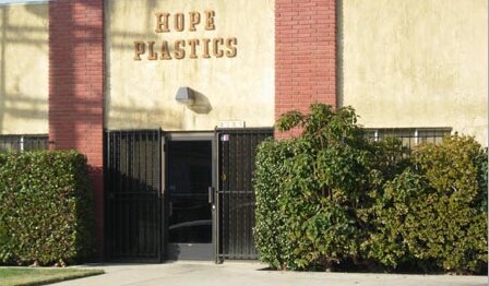 The Hope Plastics building on Strohm Avenue, with the name painted on the brick