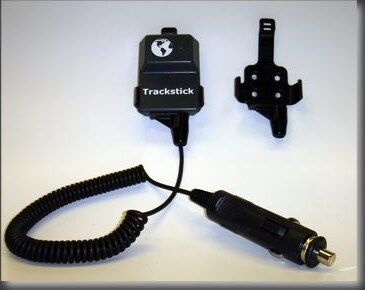Trackstick Pro GPS unit in its mounting bracket with a power cord